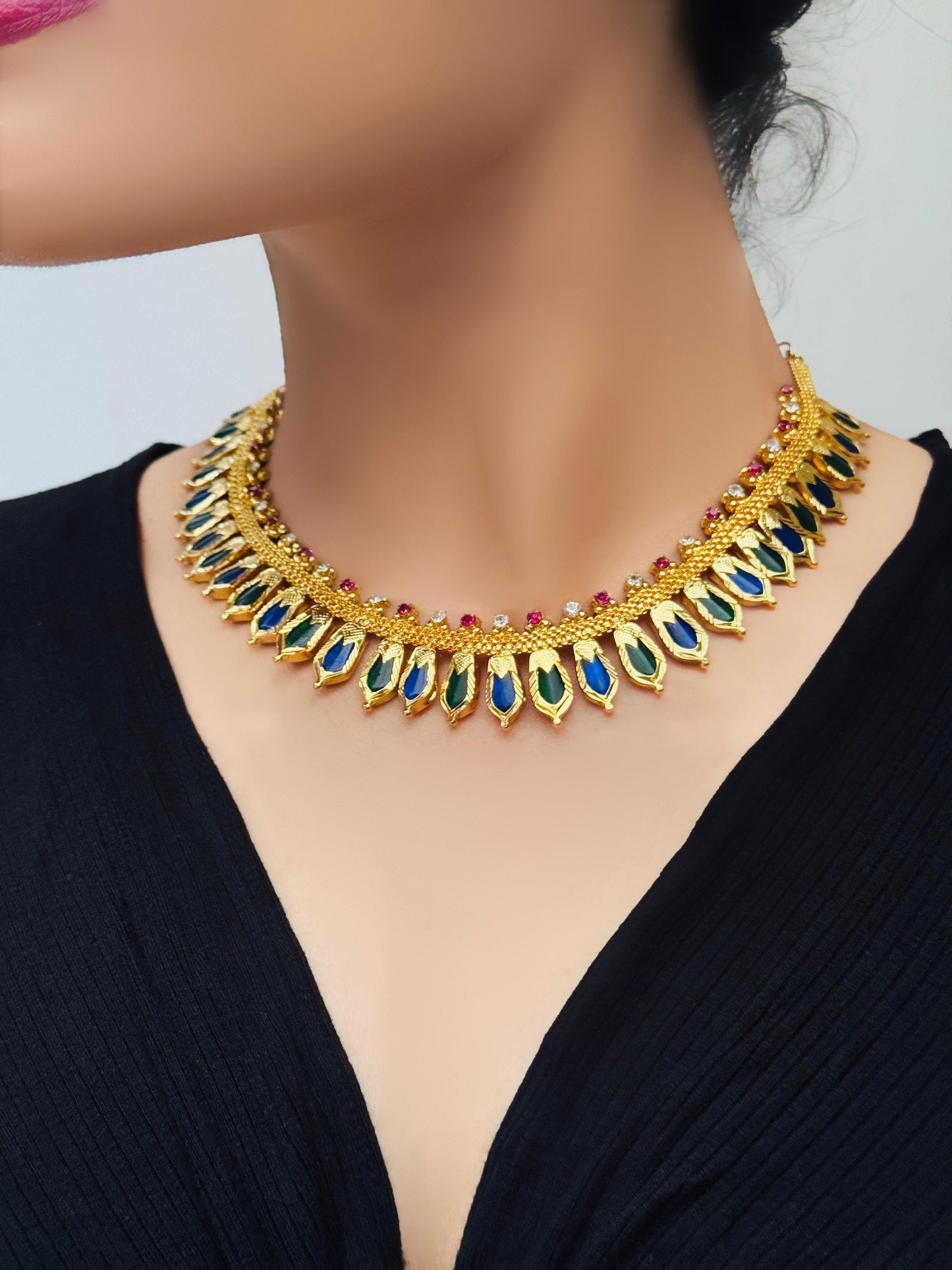 Beautifully Crafted Ananta Nagapadam 22 CT Gold-Plated Green and Blue Palakka