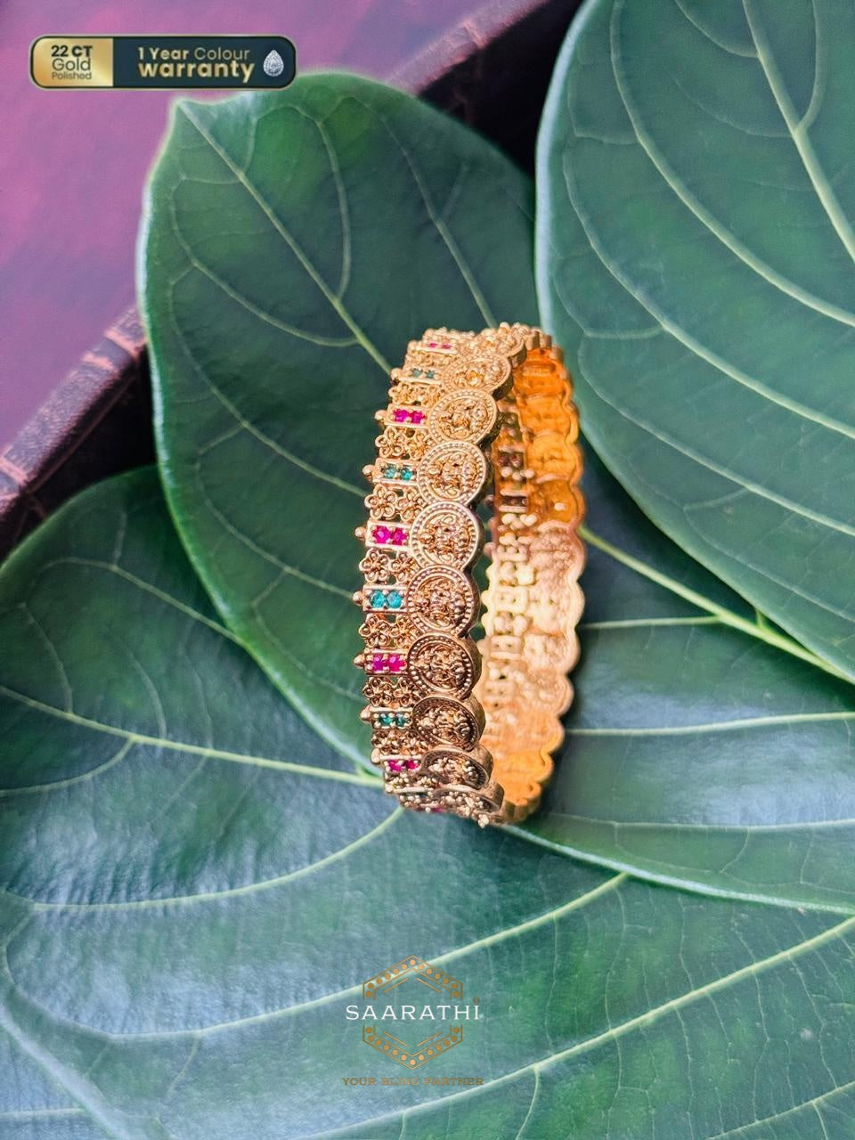 Varalakshmi 22CT Gold-Polished Coin Bangle with Pink and Green Stone Detailing