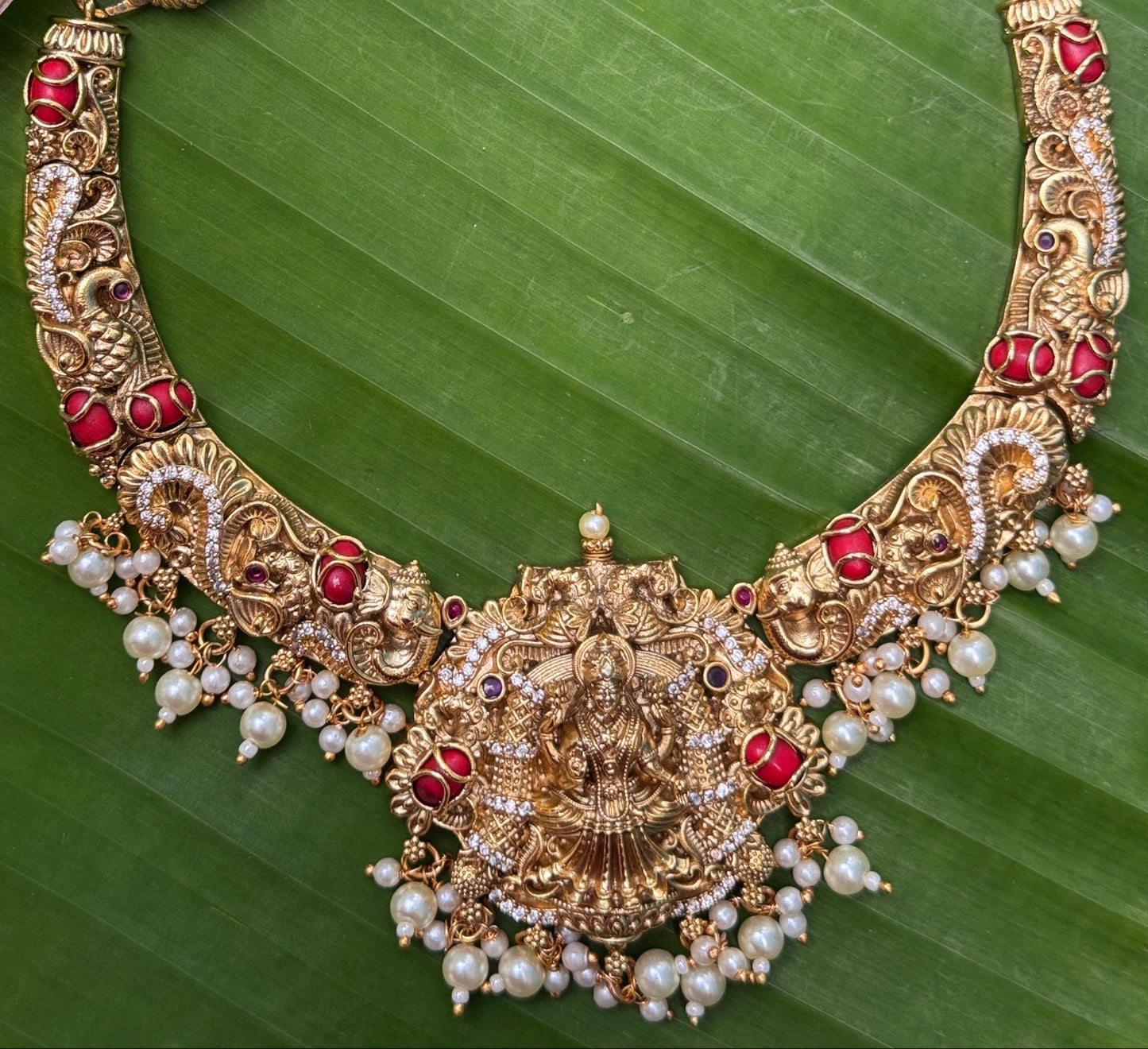 Intricate Aishwarya Haram Necklace set with Pearl and Coral detailing