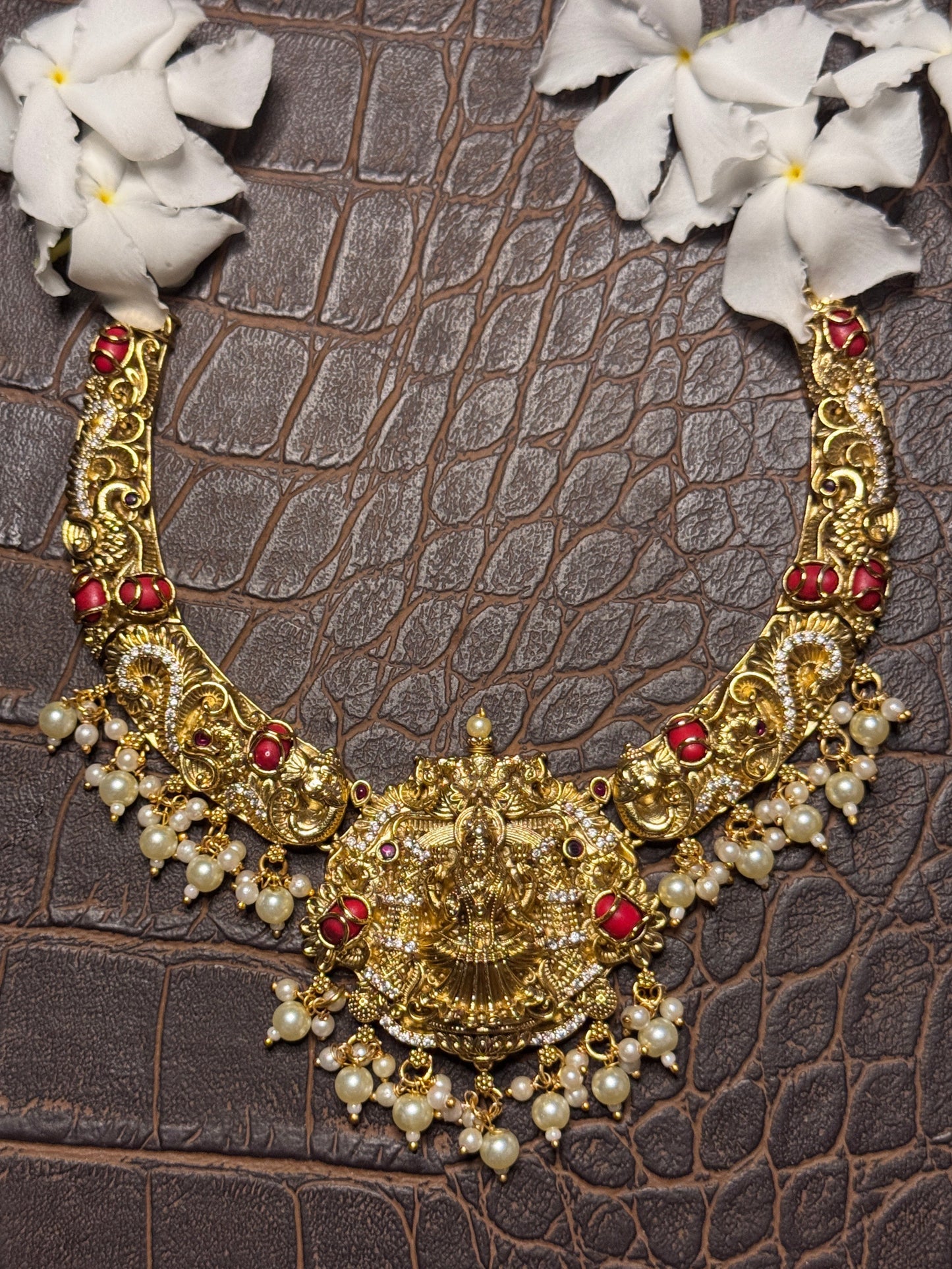 Intricate Aishwarya Haram Necklace set with Pearl and Coral detailing