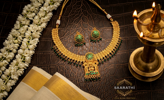 Gold-Toned Lakshmi Pendant Necklace Set with Emerald Green Detailing